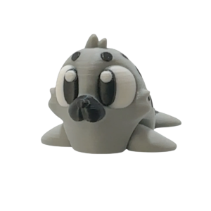 Flexi Seal articulated 3D printed seal figurine in camo color shown as a flexible desk buddy