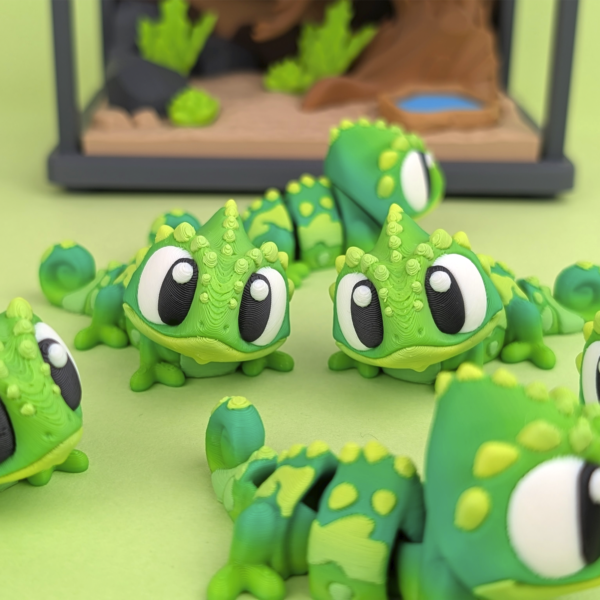 Articulated 3D printed Flexi Chameleon figurine in PLA posed on a neutral background