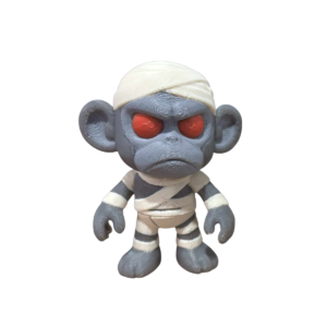 Monkey Mummy figurine by SpaceMonkey, a 3D printed Halloween decor piece for shelf, desk, or tiered tray display