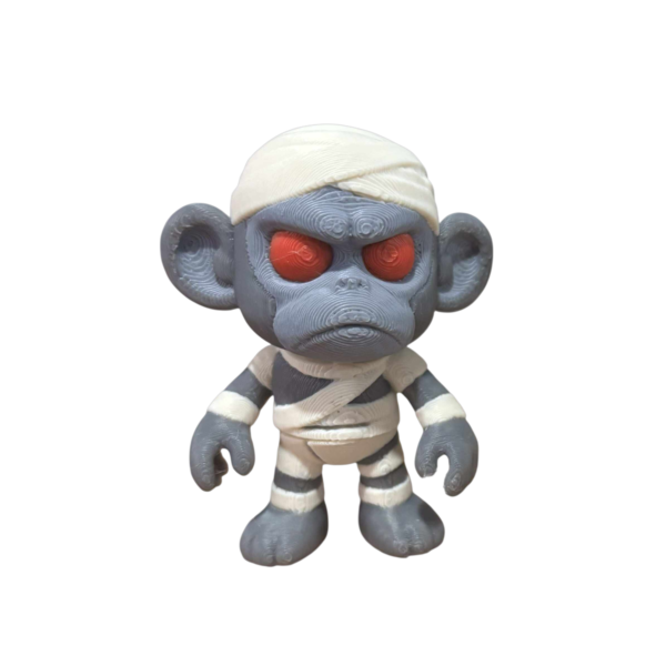 Monkey Mummy figurine by SpaceMonkey, a 3D printed Halloween decor piece for shelf, desk, or tiered tray display
